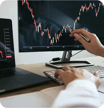 Trader analyzing Forex charts on screen